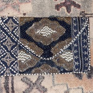 Navy blue beaded with white/silver and gold beads.  evening clutch bag